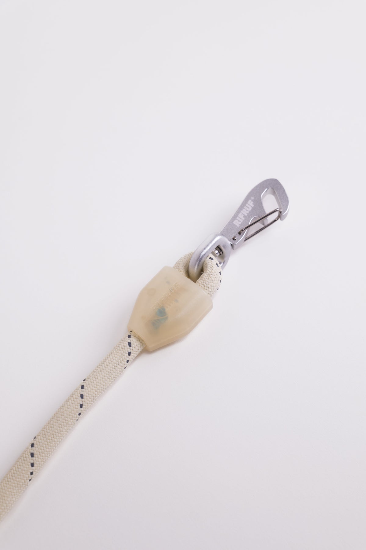 Close-up of the updated Commuter Leash clip in Bone